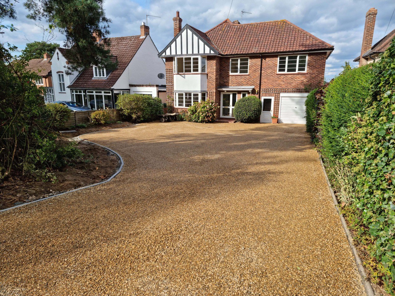 This is a newly installed tar and chip driveway installed by Thrapston Driveways